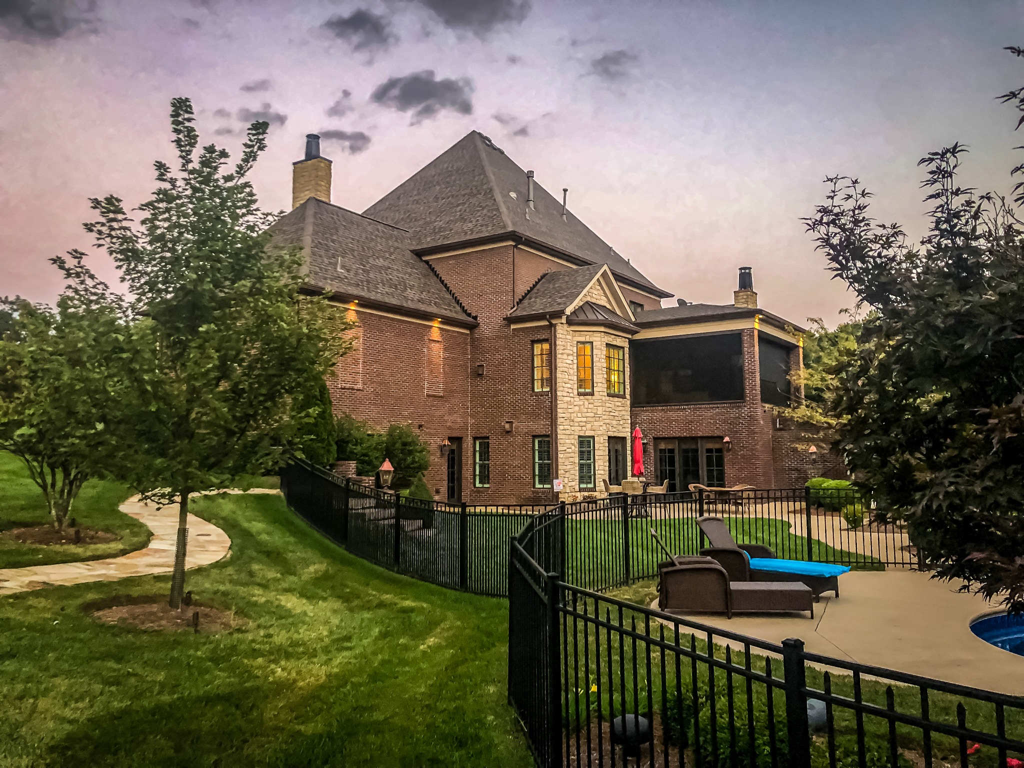 Rear of residence with patio and landscaping